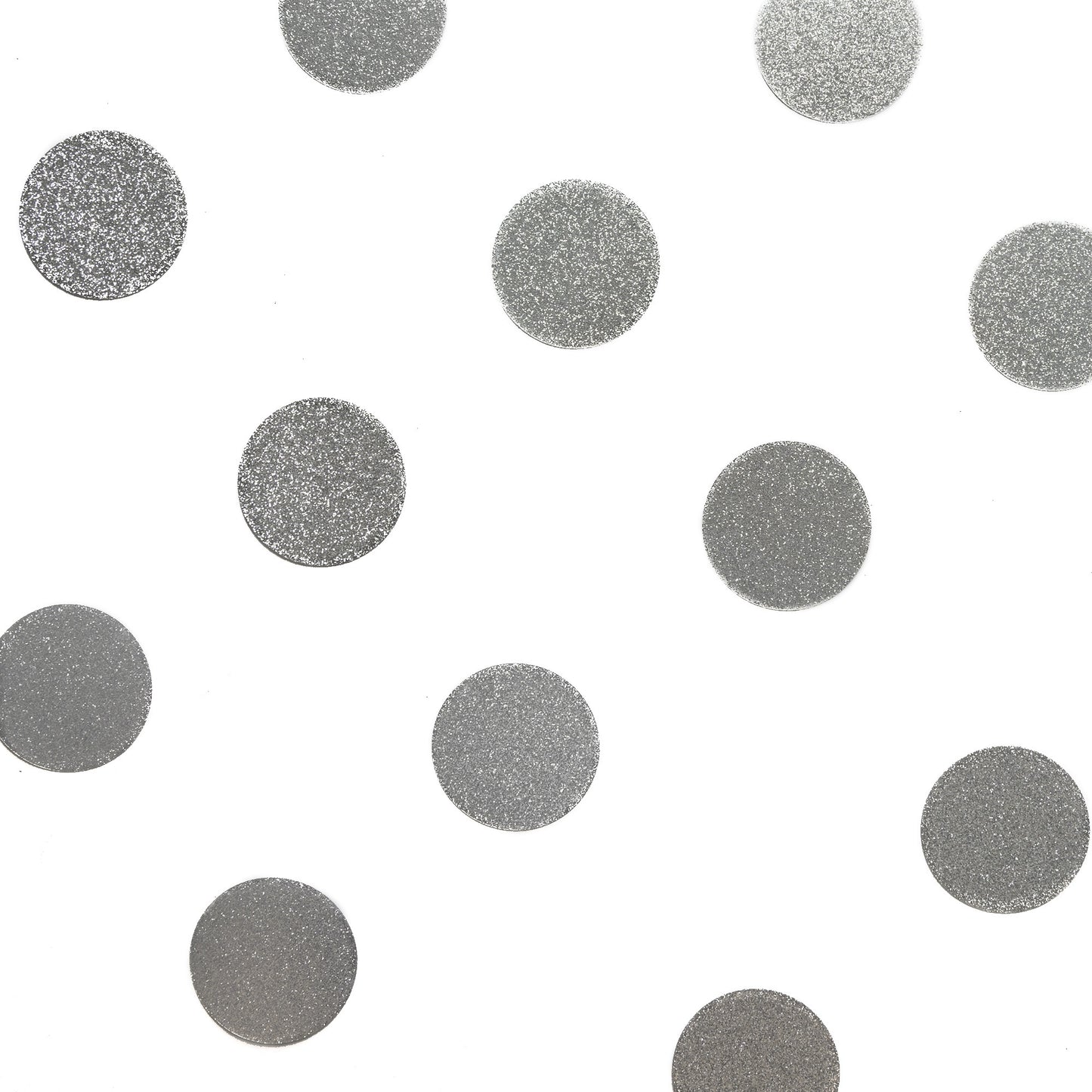 Luxe metallic silver confetti dots arranged on a white background