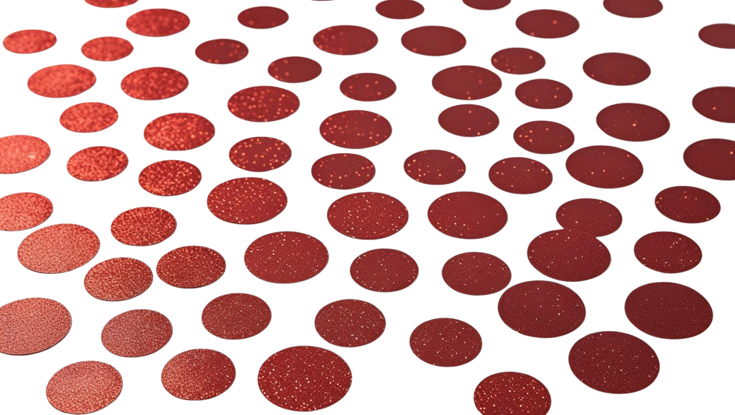 Luxe red glitter circle confetti scattered on white background