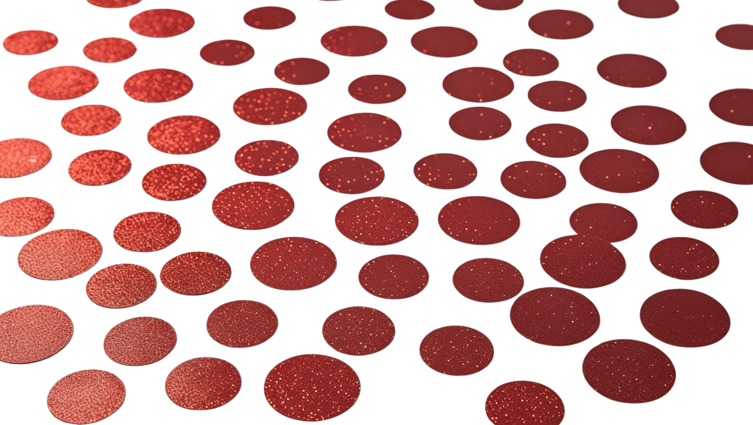 Luxe red glitter circle confetti scattered on white background
