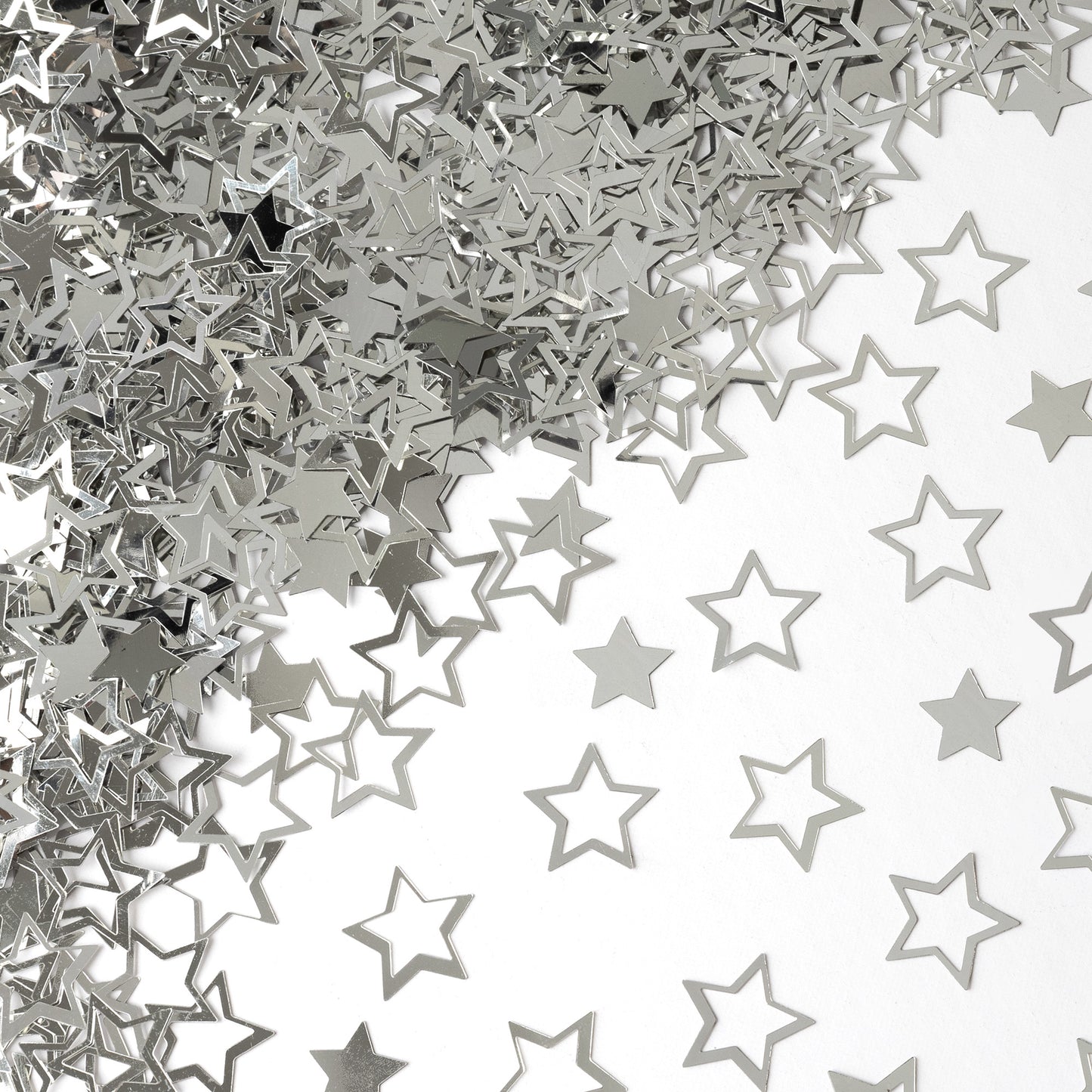 Metallic silver star confetti in hollow and solid shapes spread across a white background